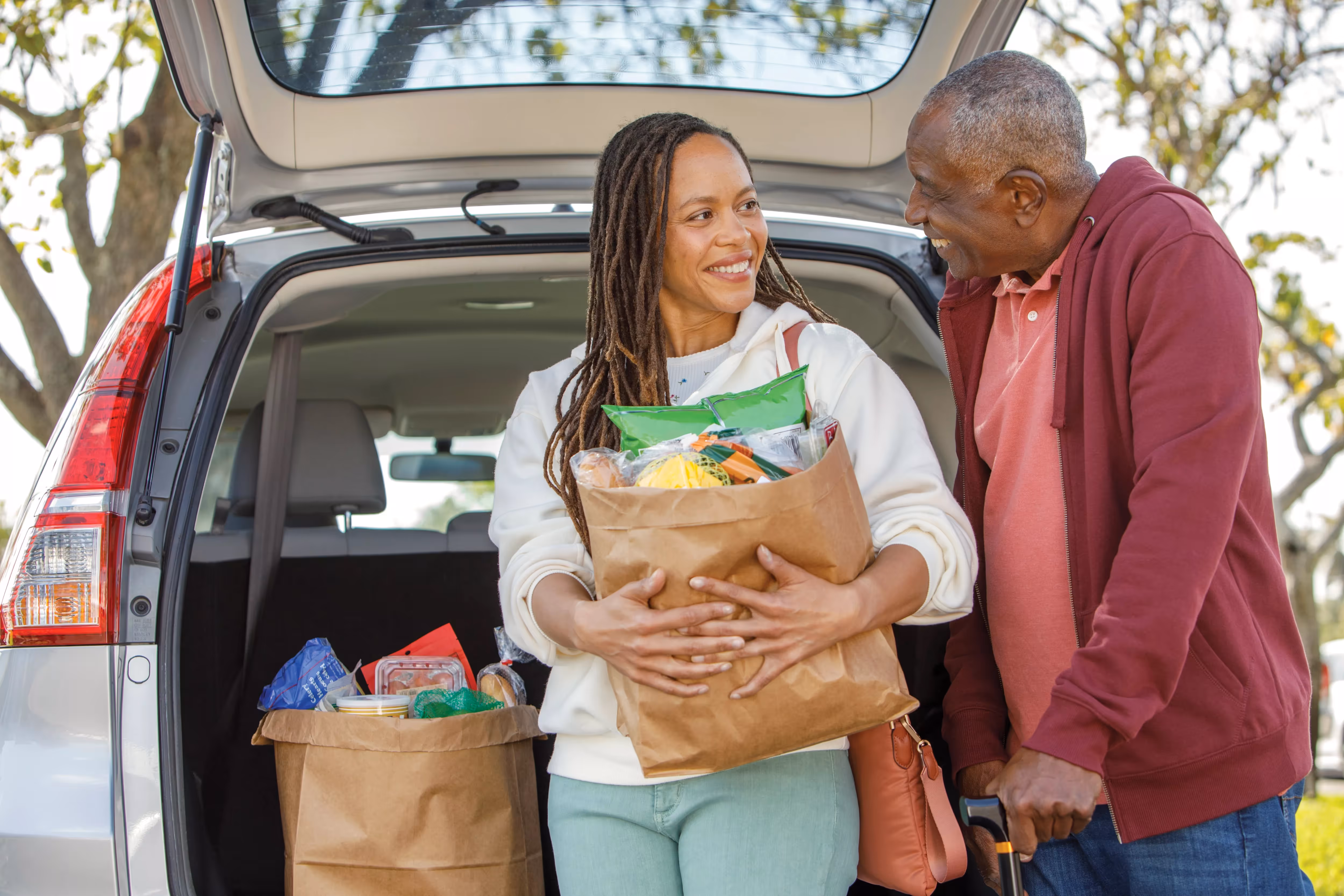 Grocery store aisle with fresh produce and a Medicare benefit card